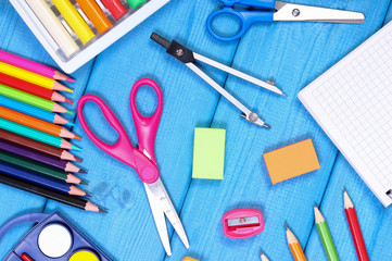 School accessories on blue boards, back to school concept
