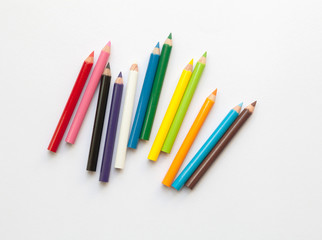 Bunch of fun mini colored pencils isolated on white. Group of wooden pencils - Powered by Adobe