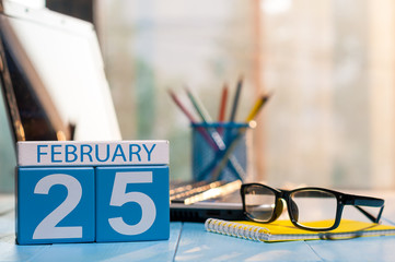 February 25th. Day 25 of month, calendar on manager workplace background. Winter concept. Empty space for text