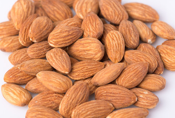 Almonds pile on white background