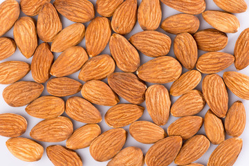 Almonds pile on white background