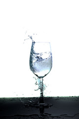 water splash in glass isolated on white