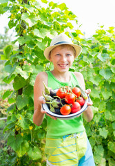  boy with a bowl of vegetables