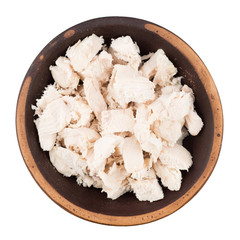 Boiled chicken meat in a ceramic bowl.