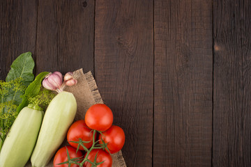 Ripe vegetables on an old wooden table.