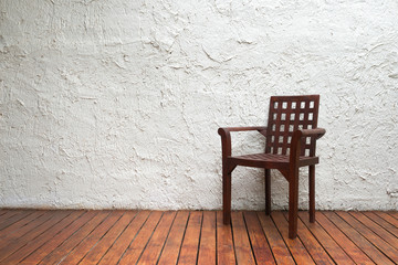 Fototapeta na wymiar Brown chair in room with wooden floor