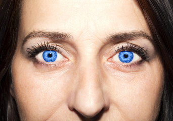 Fototapeta premium Beautiful insightful look blue woman's eyes