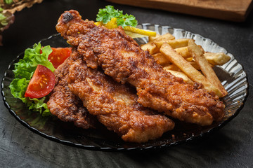 Fried fish in crispy batter with chips