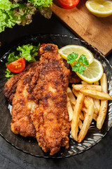 Fried fish in crispy batter with chips