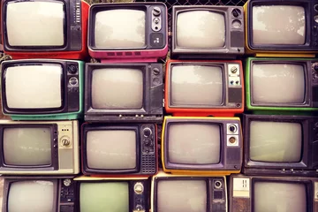 Gordijnen Patroonmuur van stapel kleurrijke retro televisie (TV) - vintage filtereffectstijl. © jakkapan