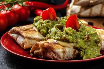 Mexican chimichanga with guacamole dip