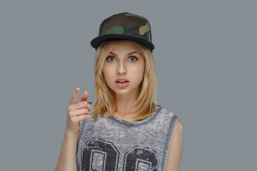 Portrait of modern hip hop female in a cap.