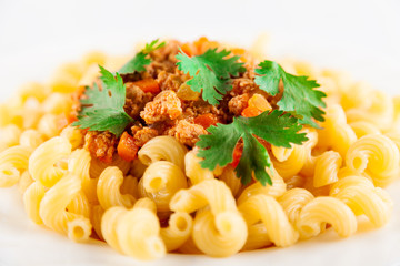 Pasta served with bolognese sauce. Traditional Italian food. Close-up, very shallow depth of field