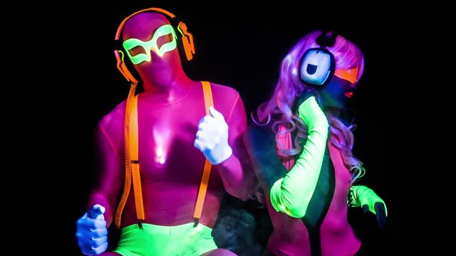 cyber raver couple in fluorescent UV glow