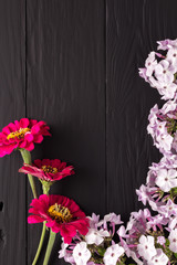 frame of flowers, background black boards