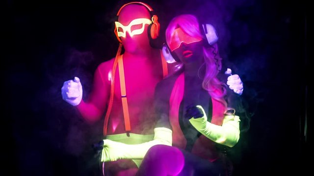 cyber raver couple in fluorescent UV glow