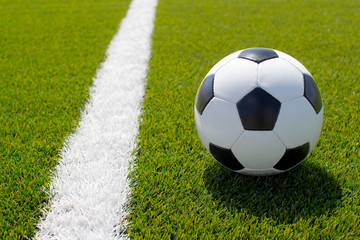 soccer ball on the green field