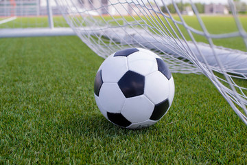 Fototapeta na wymiar soccer ball in net