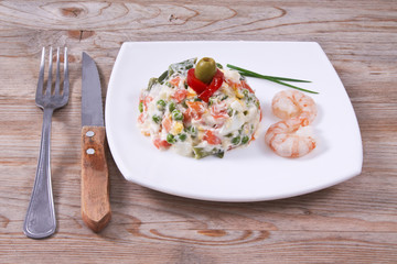 vegetable salad and seafood in a bowl