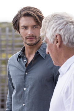 Father and son talking outside