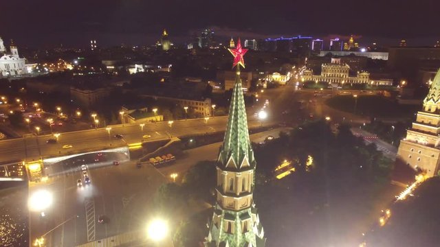 Approach to kremlin star. Best unique night flight close to Moscow Kremlin and Red Square. Evening embankment road traffic. City illumination. 4k footage. Aerial drone quadcopter.