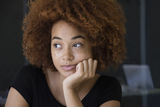 Close-up of a young woman thinking