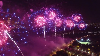 Great firework show in Moscow Russia near MSU Moscow State University. Unique close aerial view, flight inside, quadcopter drone footage. Beautiful colors from above. 4K footage. - Powered by Adobe