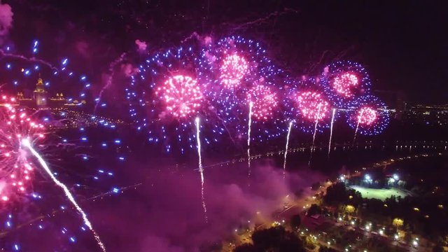 Great firework show in Moscow Russia near MSU Moscow State University. Unique close aerial view, flight inside, quadcopter drone footage. Beautiful colors from above. 4K footage.
