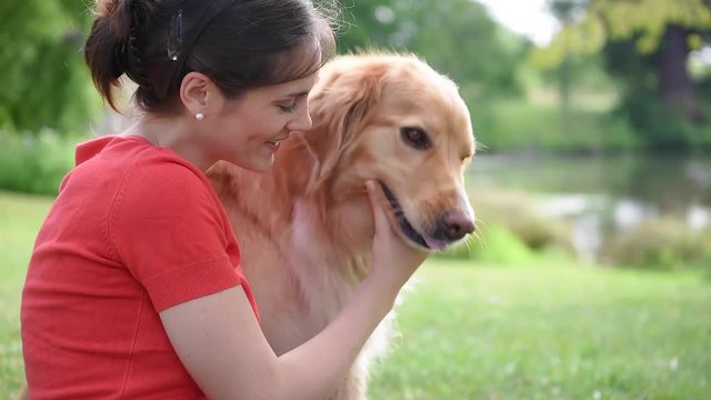Portrait of woman with dog at the park