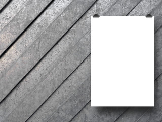 Close-up of one blank frame hanged by clips against gray metal background