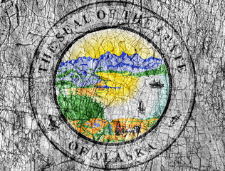 Fototapeta na wymiar Grudge stone painted US Alaska seal flag