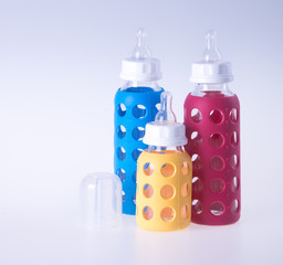 baby glass bottle. baby glass bottle on a background.