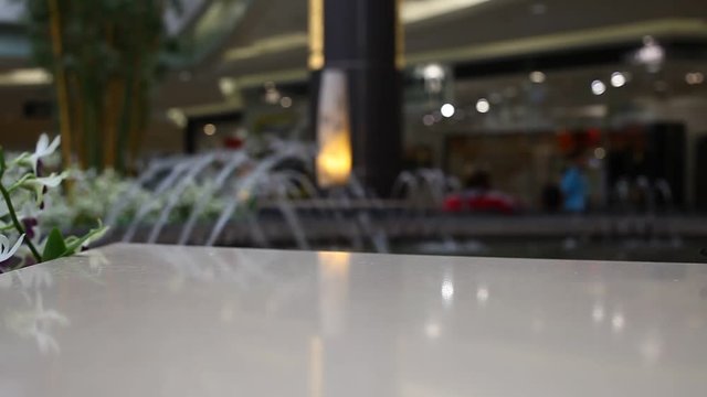 Blurred water fountain at shopping mall background