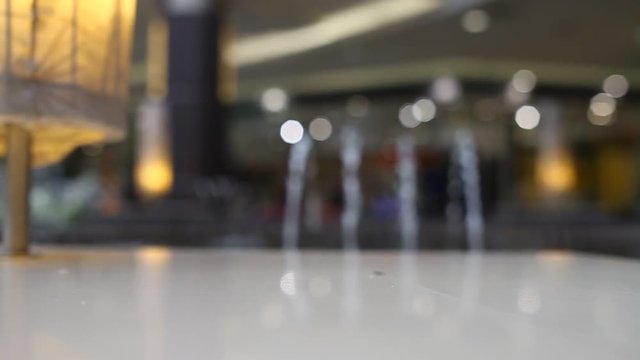 Blurred water fountain at shopping mall background