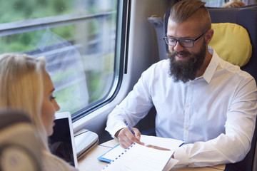 Business meeting during the traveling by train