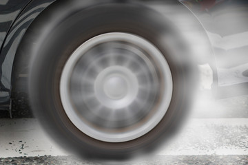Car wheel drifting and smoking on track dark edition
