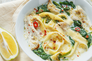 Coconut Curry Chicken Soup with noodles in a plate