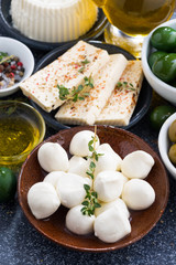 snacks - soft cheeses and pickles, vertical, top view © cook_inspire