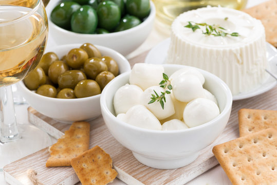 soft cheeses, crackers and pickles for wine, close-up