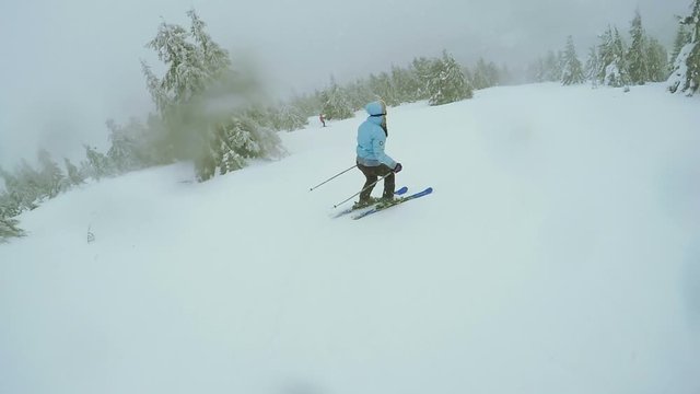 Woman Ski descent in nature
