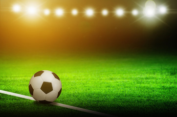 Soccer ball on green stadium