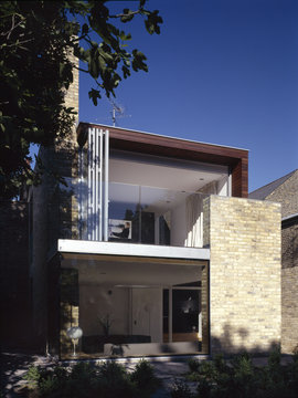 Rear of house with sliding doors open.