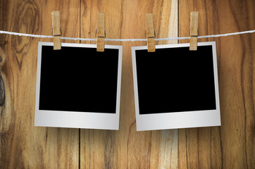 Blank photo frame with clothespin hanging.