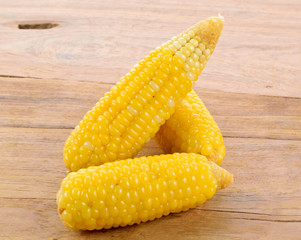 Ear of corn on the wooden table