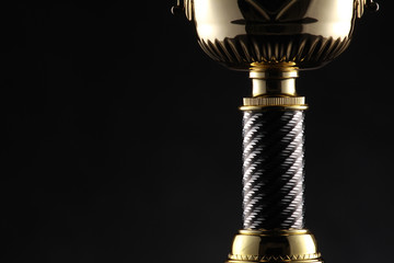 big award winning trophy in black background