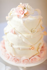 Perfect wedding cake decorated with pink glaze roses