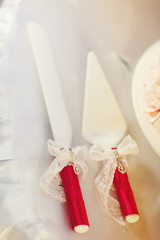 Set for a cake lies on the white table