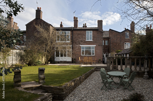 "Back garden and lawn of a brick terraced house" Stock photo and