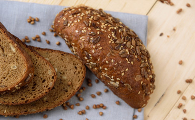 Fresh crusty bread on the plate and wheat ears