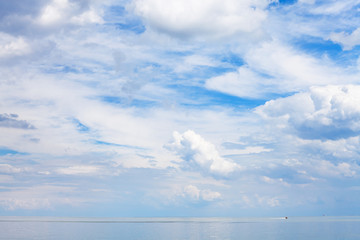 Naklejka na ściany i meble blue sky with clouds over calm water Sea of Azov